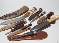 Eight knives including hunting knives, and bone handled Kukri example, the largest 42cm in length