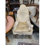 An 18th century style upholstered wing armchair, width 81cm, depth 76cm, height 126cm