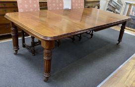 A late Victorian mahogany extending dining table, length 230cm extended, two spare leaves, width