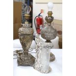 Two plated table lamps with scrolled and floral decoration together with a plated figural stand