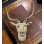 A large carved and painted wooden fallow dear, set with antlers, 84cm high
