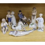 Seven mixed Royal Copenhagen models including children, fish, a fawn, a sailor, a cow and a seahorse