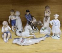 Seven mixed Royal Copenhagen models including children, fish, a fawn, a sailor, a cow and a seahorse