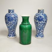 A pair of Chinese blue and white vases and a green glazed vase, blue vases 22.5cm high