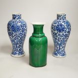 A pair of Chinese blue and white vases and a green glazed vase, blue vases 22.5cm high