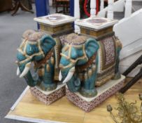 A pair of Chinese Guandong pottery ‘elephant and howdah’ stands, 56cm high