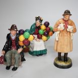 Three Royal Doulton figures comprising Lambing Time HN1890 and The Balloon man HN1954, the largest