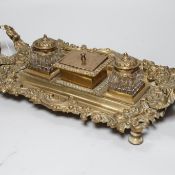 An early 20th century French cast brass desk stand, 45cm long