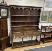 A late 18th /early 19th century oak pot board dresser with boarded rack (incorporating some new