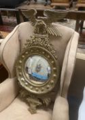 A Regency style giltwood and composition convex wall mirror, width 44cm, height 97cm