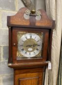 An early 19th century mahogany and banded oak eight day longcase clock marked Thomas Quested, Wye,