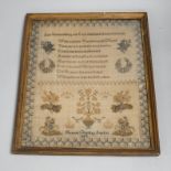 A mid 19th century framed sampler worked by Hannah Clarice, aged 13, 1853, embroidered with a
