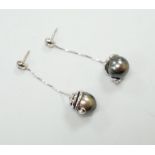 A modern pair of 750 white metal and diamond set cultured black pearl drop earrings, approx. 45mm,