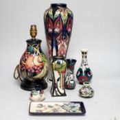 A group of Moorcroft vases, a lamp base and a pin dish, tallest 37cm