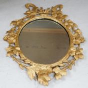 A Victorian carved gilt wood framed wall mirror, 66x50cm
