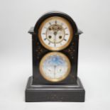 A late 19th century French black slate mantel clock with brocot style escapement and second dial