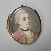 An 18th century oval portrait miniature on ivory of a gentleman wearing a frock coat, housed in a