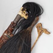 A Borneo 'headhunter's sword', a bone carving and feather swot (3), sword 77 cm long