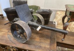 A cast iron model artillery cannon, length 112cm