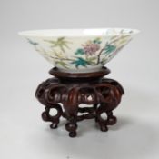 A Chinese famille rose conical bowl, Xuande mark but Republic period, wood stand 10cm diameter