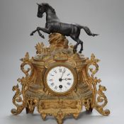 A late 19th century French gilt metal horse mounted clock, 35cm