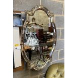 A Venetian style gilt metal oval wall mirror, width 71cm, height 111cm