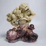 A Chinese soapstone sculpture of a lion dog group, 31.5cm high