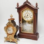 An early 20th century German walnut and gilt metal mantel clock and an American shelf clock, tallest