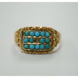 A Victorian gold dress ring, set with three rows of small turquoise flanked by floral carved