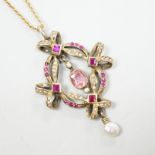 An early 20th century Continental gilt white metal pendant set with rubies, seed pearls and other