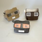 A collection of 21 View-Master viewers, including various models, a View-Master Projector and a