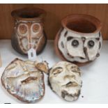 Two Papa New Guinea pottery face masks and two cooking pots,