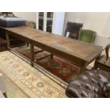 A 19th century French oak serving table, length 300cm, depth 100cm, height 85cm