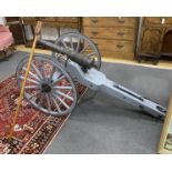 A model artillery cannon with composition barrel on painted spoke frame, length 193cm, height 84cm
