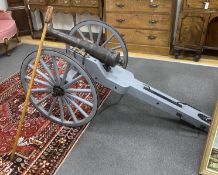 A model artillery cannon with composition barrel on painted spoke frame, length 193cm, height 84cm