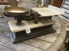 A set of Victorian brass mounted cast iron and white marble scales, width 48cm, depth 26cm, height