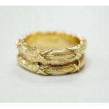 A Theo Fennell 18ct gold ring with two ribbon tied reeded bands, hallmarked for 2001, size M, 9.8