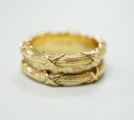 A Theo Fennell 18ct gold ring with two ribbon tied reeded bands, hallmarked for 2001, size M, 9.8