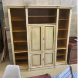 A reproduction Continental painted breakfront bookcase / media cabinet, width 204cm, depth 55cm,