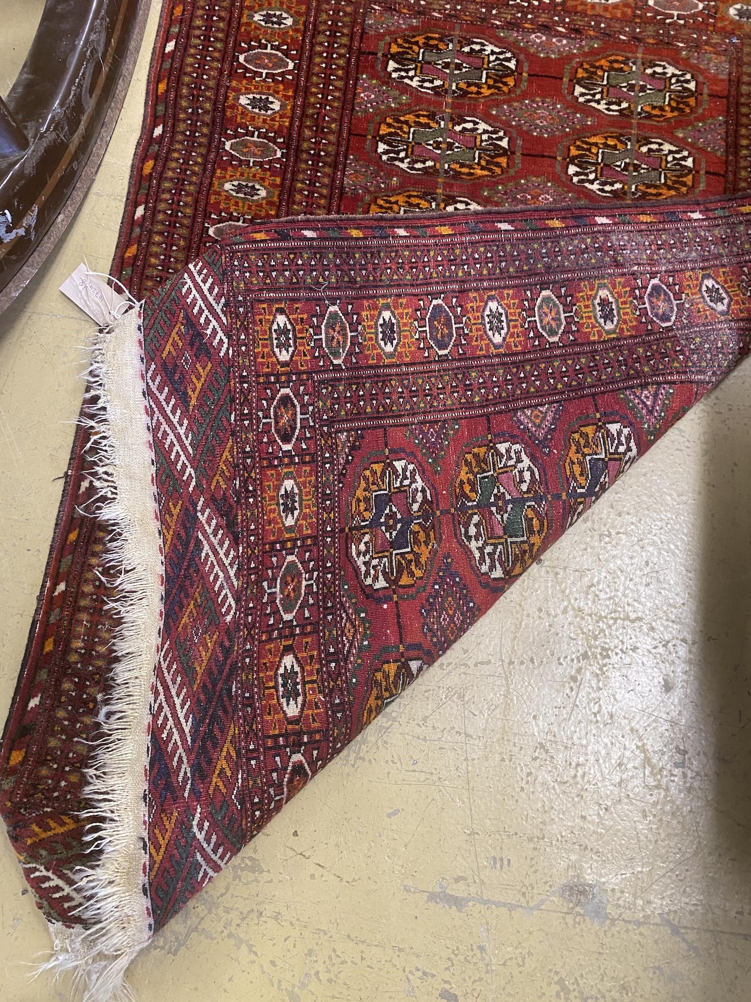 A North West Persian rug and a Bokhara rug, larger 114 x 84cm