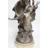 After H. Francois Moreau, a large spelter group of Cupid and a mermaid before a giant conch shell,