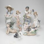 A large Lladro figure of a flower girl, mermaid, boy playing a drum and five other models