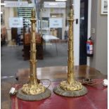 A pair of decorative gilt metal table lamps, 54cm excluding light fitting