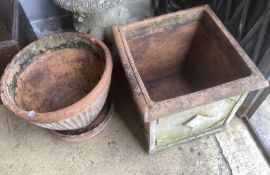 A square weathered terracotta garden planter, width 52cm, height 50cm together with a circular