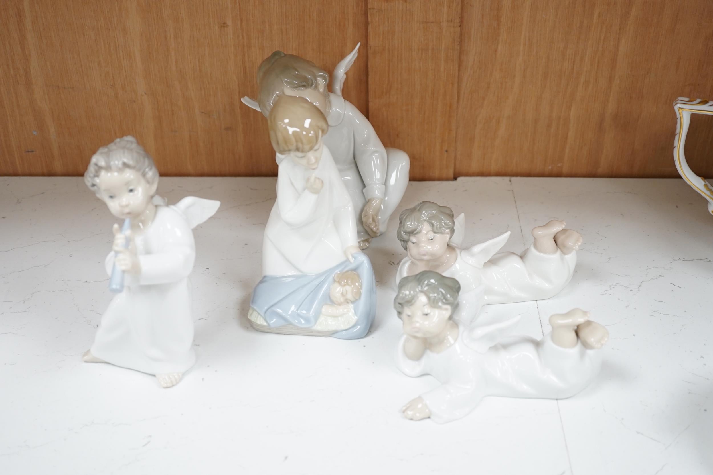 A large Lladro figure of children in a pram, seven models of angels and a boy with a dog (9) - Image 2 of 5