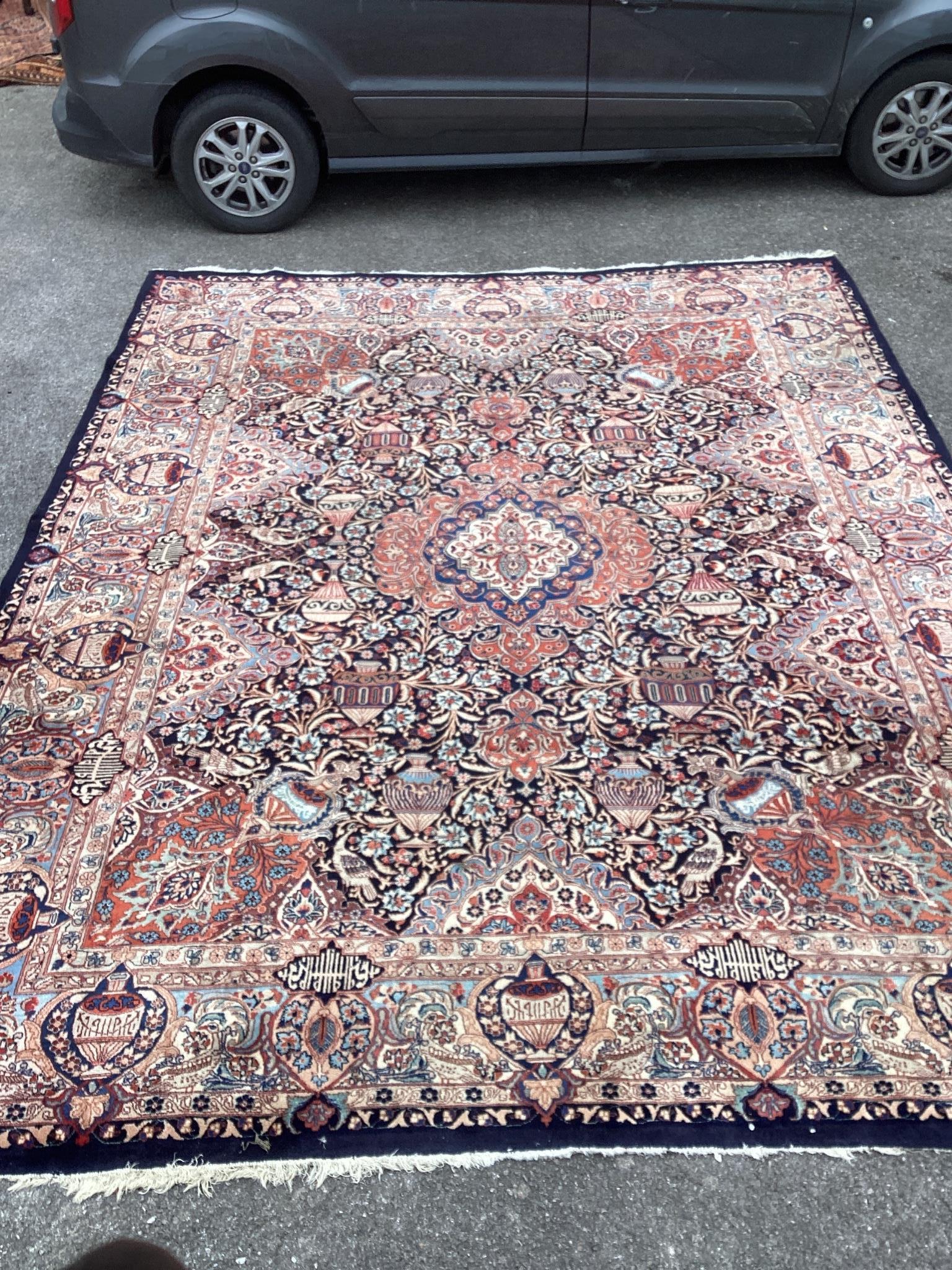 A Tabriz blue ground carpet, 390 x 290cm