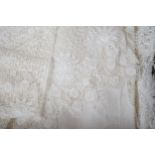 A collection of hand made finely worked tatting lace table linen, including cloths mats and napkins