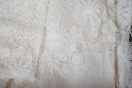 A collection of hand made finely worked tatting lace table linen, including cloths mats and napkins