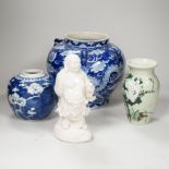 A group of Chinese ceramics including a celadon glazed vase, blue and white jar, white glazed figure