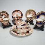 Three pairs of Royal Crown Derby porcelain cups and saucers, another Spode and a Victorian trio